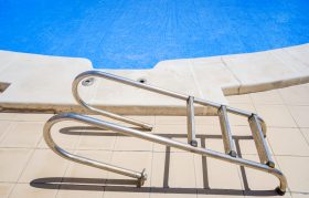 Pool ladder out of the water during repairs
